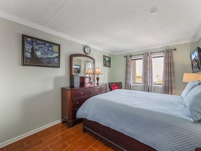 bedroom with dark wood-type flooring, baseboards, ornamental molding, and a textured ceiling