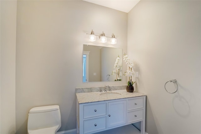 half bath with toilet and vanity
