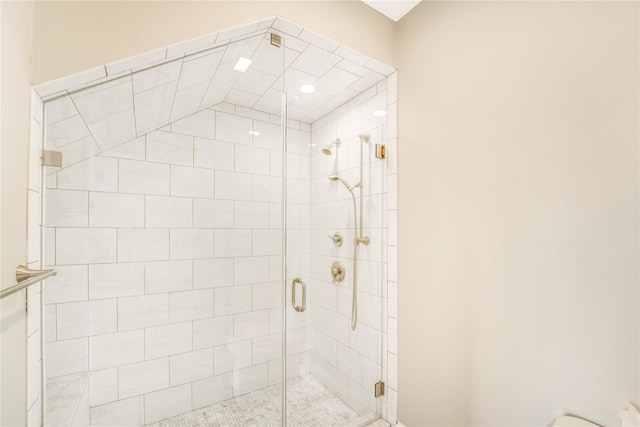 full bath featuring a shower stall