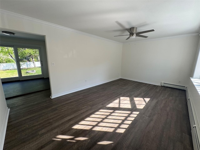 spare room with dark wood-type flooring, ornamental molding, and baseboards