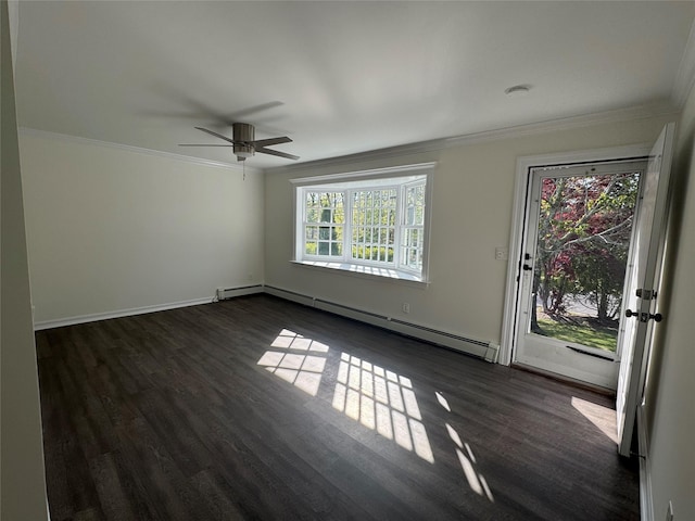 empty room featuring ornamental molding, baseboards, dark wood-style floors, baseboard heating, and a ceiling fan