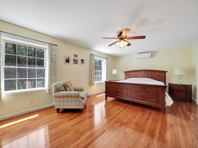 25 Devlin Rd, Eldred, NY 12743 - bedroom featuring baseboards, a ceiling fan, light wood finished floors, and a wall unit AC