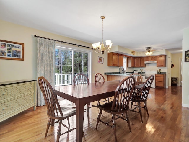 25 Devlin Rd, Eldred, NY 12743 - dining room with wood finished floors and ceiling fan with notable chandelier
