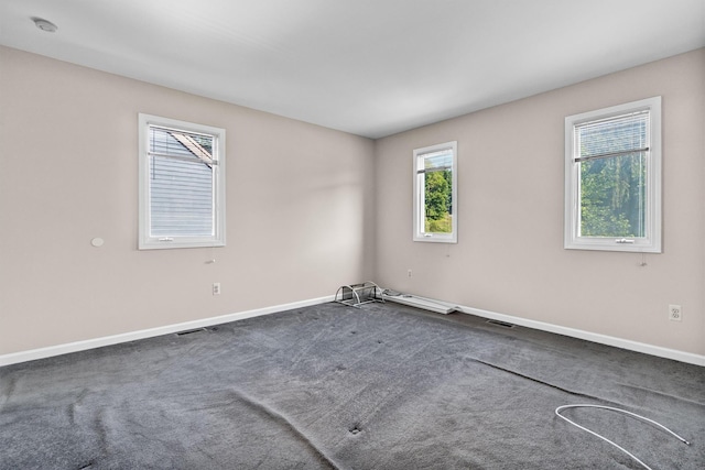 5702 Manor Dr Unit 5702, Peekskill, NY 10566 - spare room with baseboards and dark carpet