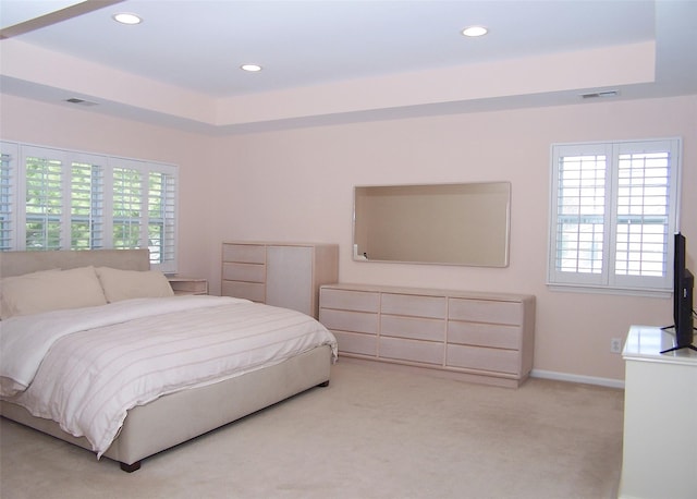 11 Arielle Ct, Islandia, NY 11749 - bedroom featuring a raised ceiling, visible vents, and light colored carpet