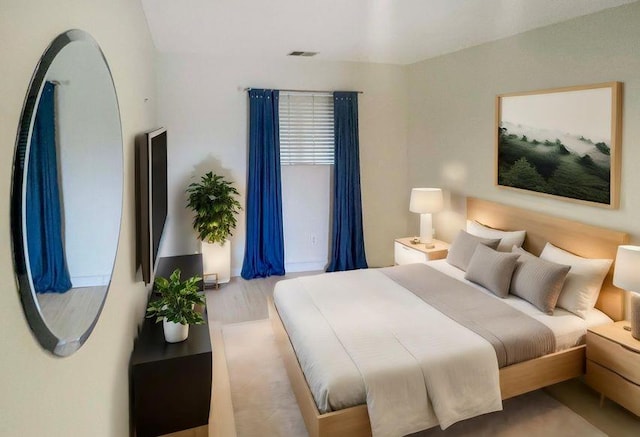 61 W Tiana Rd Unit 3, Hampton Bays, NY 11946 - bedroom featuring visible vents and wood finished floors