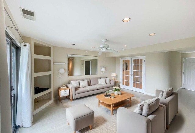 61 W Tiana Rd Unit 3, Hampton Bays, NY 11946 - living area with recessed lighting, french doors, light wood-type flooring, visible vents, and a ceiling fan