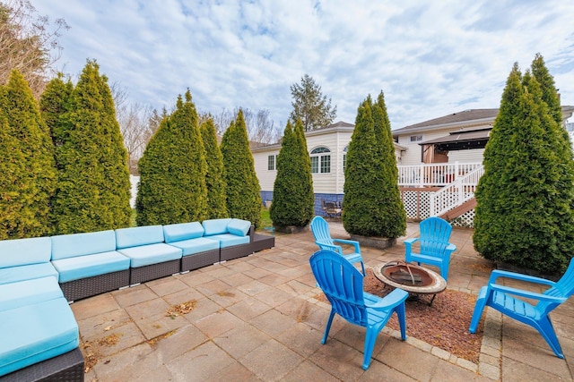 view of patio / terrace featuring a gazebo and an outdoor living space with a fire pit