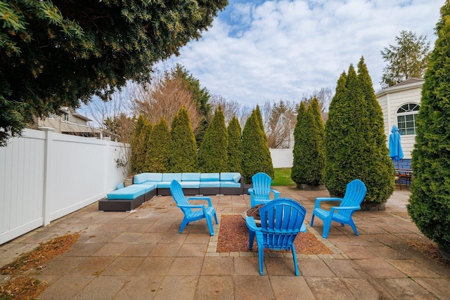 view of patio featuring an outdoor hangout area and a fenced backyard