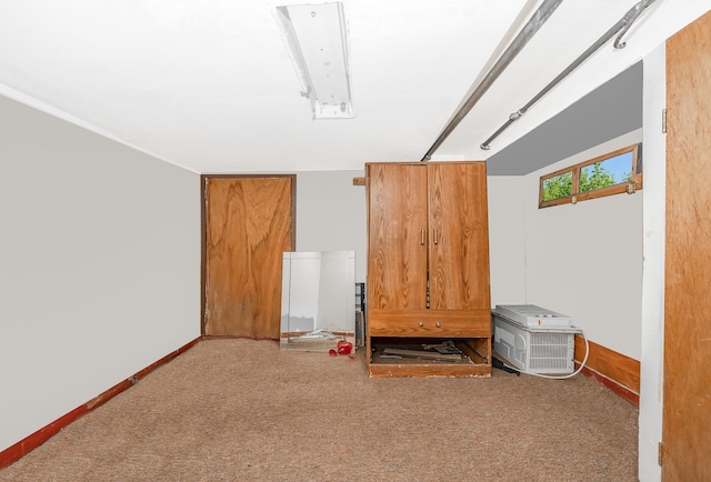 additional living space featuring baseboards and carpet floors