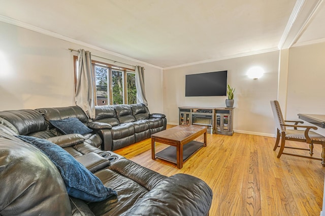 82 Coventry Gdns, Lynbrook, NY 11563 - living room featuring ornamental molding, light wood-style floors, and baseboards
