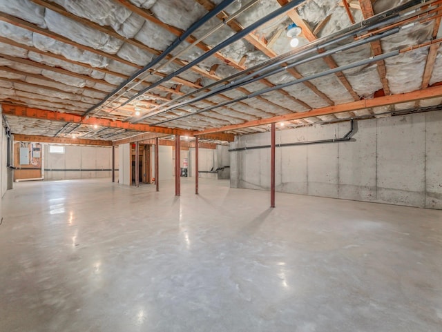 basement featuring electric panel