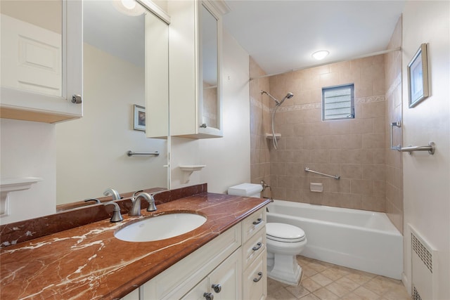 full bath with visible vents, vanity, tile patterned floors, toilet, and tub / shower combination