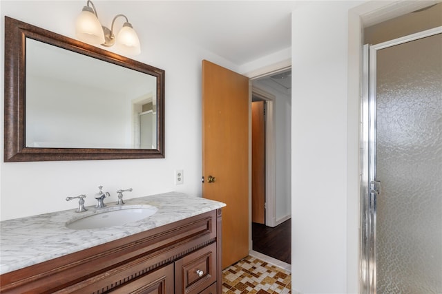 full bathroom with vanity and a shower stall