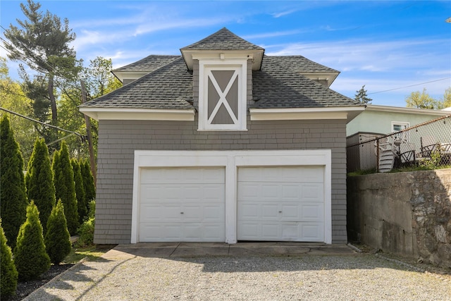 detached garage with fence