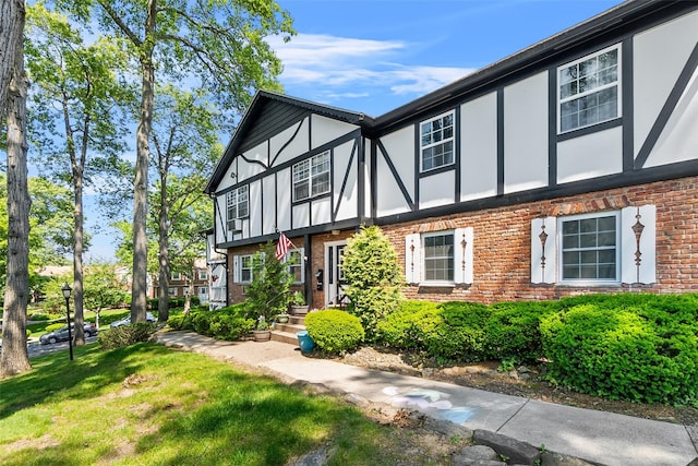 129 Parkside Dr, Suffern, NY 10901 - tudor house featuring brick siding, stucco siding, and a front yard