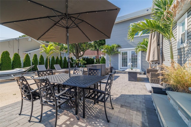 645 Hawkins Blvd, Copiague, NY 11726 - view of patio featuring outdoor dining space and french doors