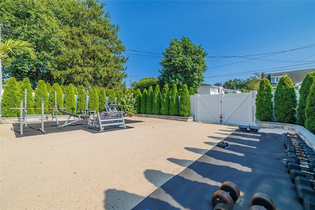 645 Hawkins Blvd, Copiague, NY 11726 - view of patio / terrace featuring a gate and fence