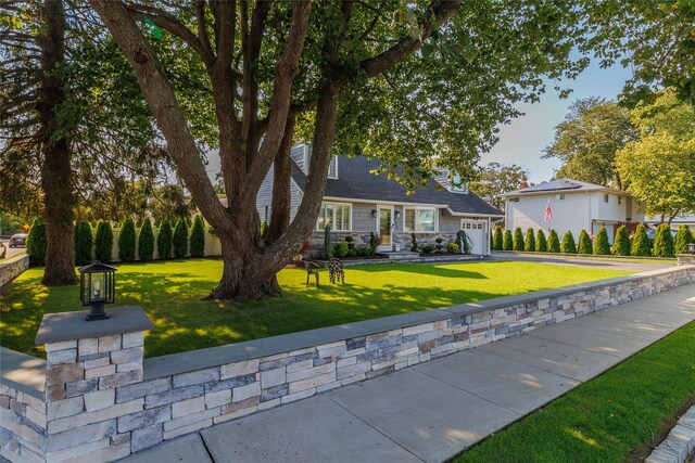645 Hawkins Blvd, Copiague, NY 11726 - view of front facade with a garage and a front lawn