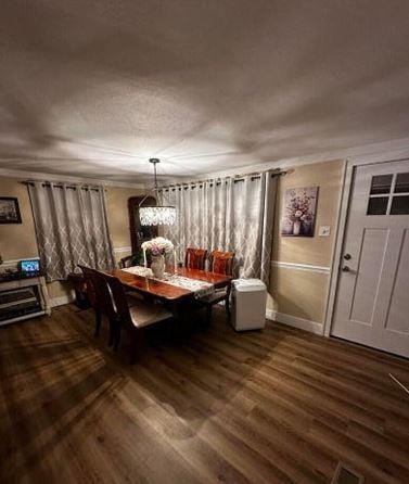 12 Bluebird Dr, Lake Luzerne, NY 12846 - dining area featuring dark wood-type flooring and baseboards