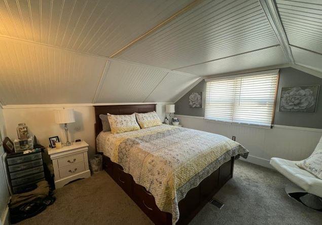 12 Bluebird Dr, Lake Luzerne, NY 12846 - bedroom with carpet, vaulted ceiling, and wooden ceiling