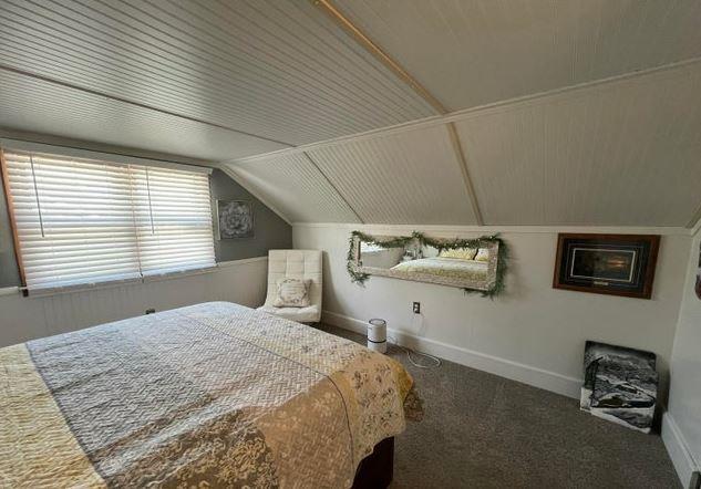 12 Bluebird Dr, Lake Luzerne, NY 12846 - bedroom with vaulted ceiling and carpet floors