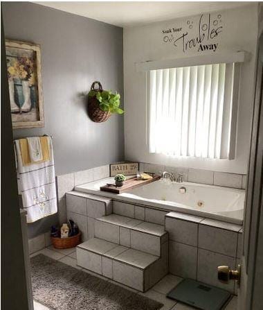 12 Bluebird Dr, Lake Luzerne, NY 12846 - full bath with a tub with jets and tile patterned flooring