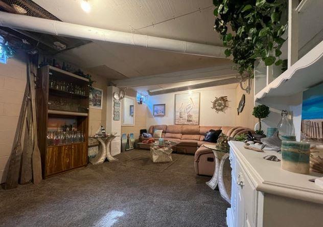 12 Bluebird Dr, Lake Luzerne, NY 12846 - living area with carpet floors