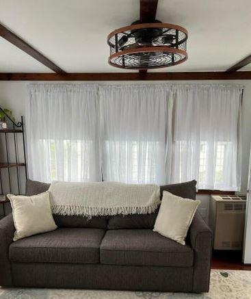 12 Bluebird Dr, Lake Luzerne, NY 12846 - living room with healthy amount of natural light and beam ceiling