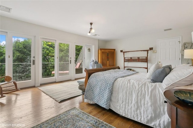 30 Appleton Pl, Dobbs Ferry, NY 10522 - bedroom featuring access to exterior, french doors, and wood finished floors