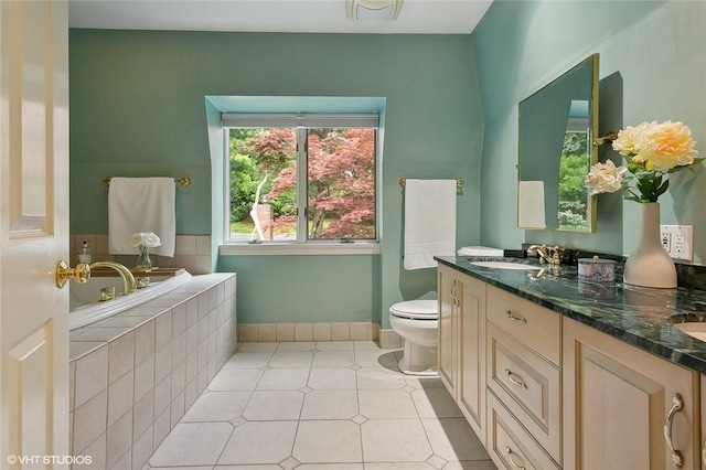 30 Appleton Pl, Dobbs Ferry, NY 10522 - bathroom featuring a bath, double vanity, toilet, baseboards, and tile patterned floors
