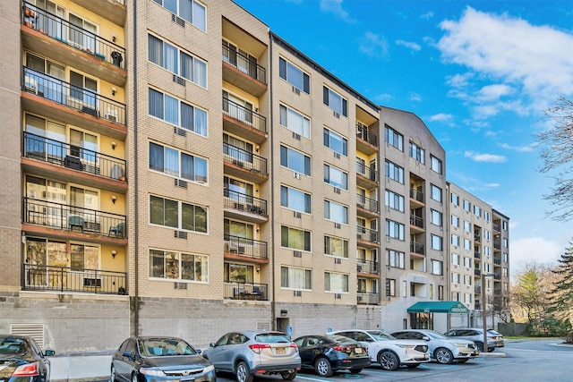 view of property with uncovered parking
