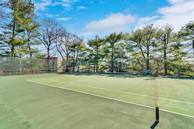 view of sport court featuring fence and community basketball court