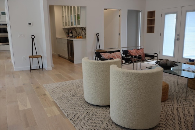 10 Hampton St, Westhampton Beach, NY 11978 - living area featuring light wood finished floors, french doors, and baseboards