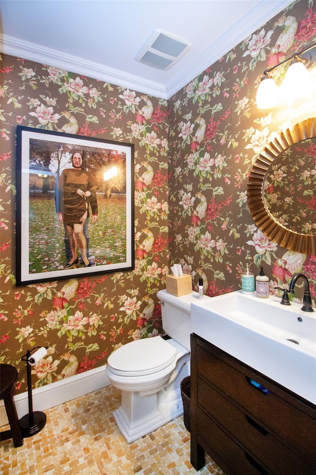 31 Paquatuck Ave, East Moriches, NY 11940 - bathroom featuring vanity, crown molding, toilet, visible vents, and baseboards