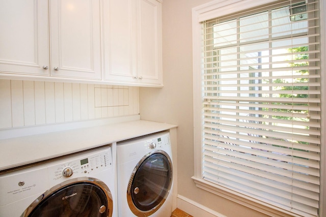 31 Paquatuck Ave, East Moriches, NY 11940 - laundry area with baseboards, a healthy amount of sunlight, cabinet space, and washing machine and clothes dryer