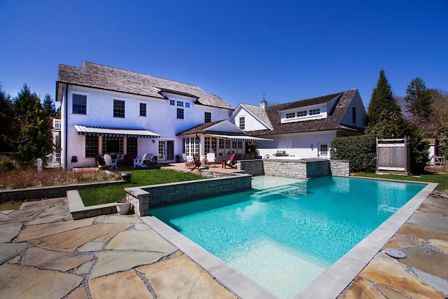 31 Paquatuck Ave, East Moriches, NY 11940 - back of house featuring a lawn, area for grilling, a patio area, outdoor lounge area, and an outdoor pool