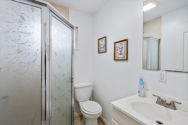 bathroom featuring a shower stall, tile patterned floors, toilet, and vanity