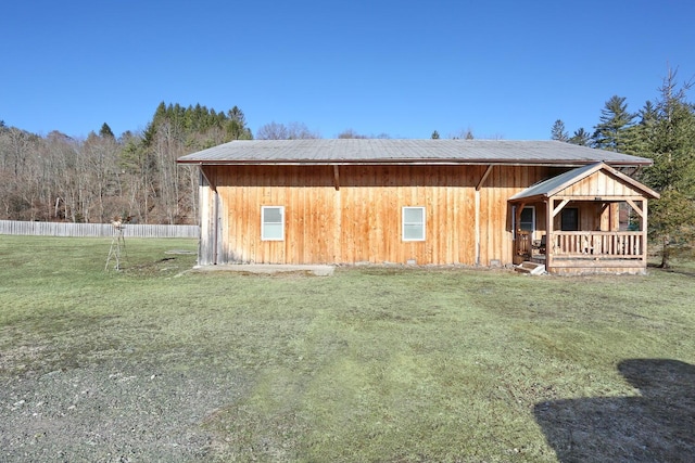 view of outdoor structure featuring fence
