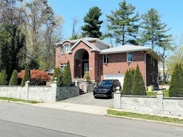 300 Ellen Pl, Oyster Bay, NY 11753 - view of front of house featuring brick siding, an attached garage, and aphalt driveway