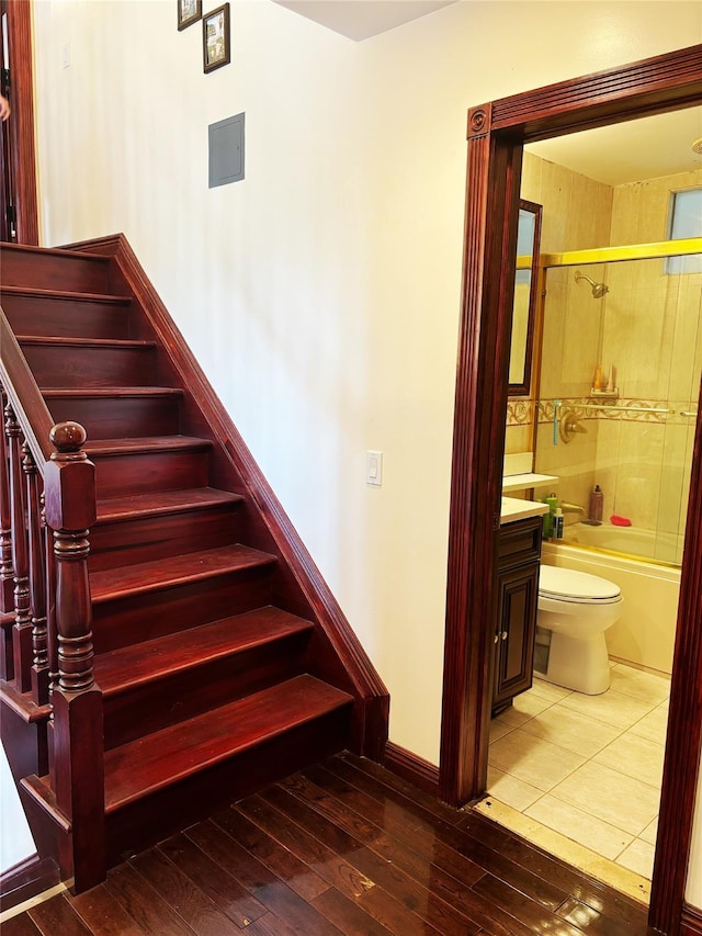 300 Ellen Pl, Oyster Bay, NY 11753 - stairway featuring baseboards and hardwood / wood-style floors