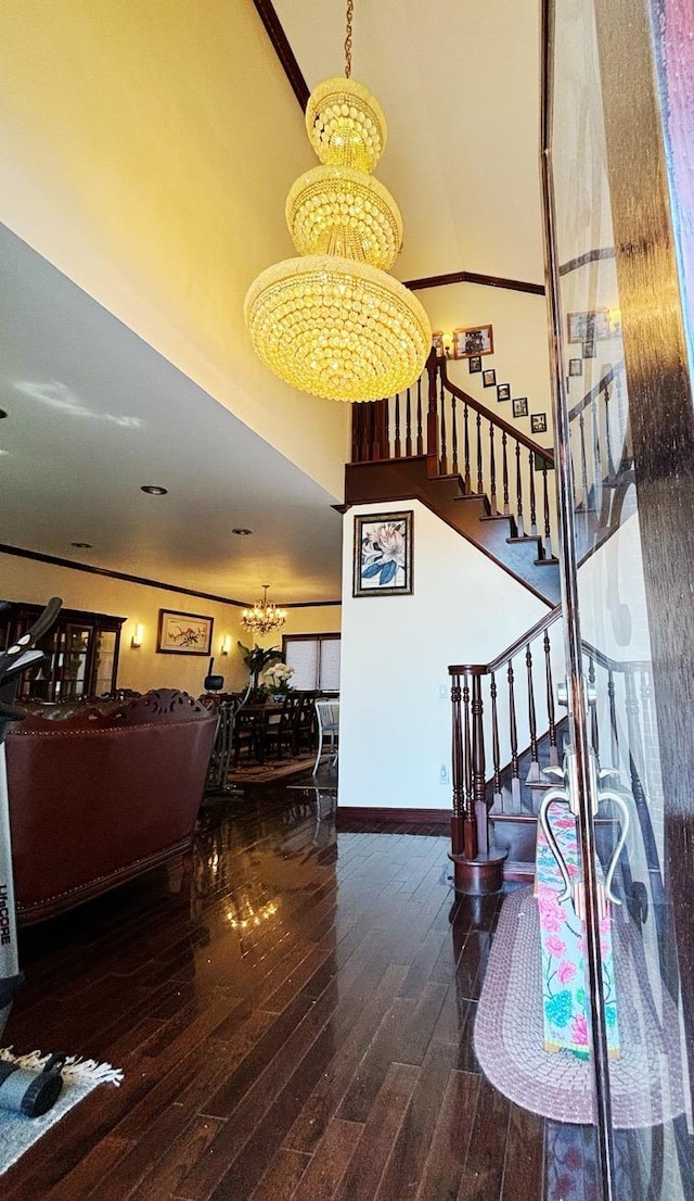 300 Ellen Pl, Oyster Bay, NY 11753 - stairs featuring a towering ceiling, baseboards, hardwood / wood-style floors, and a notable chandelier