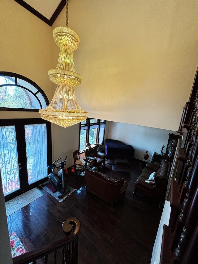 300 Ellen Pl, Oyster Bay, NY 11753 - entrance foyer with an inviting chandelier, wood-type flooring, french doors, and a towering ceiling