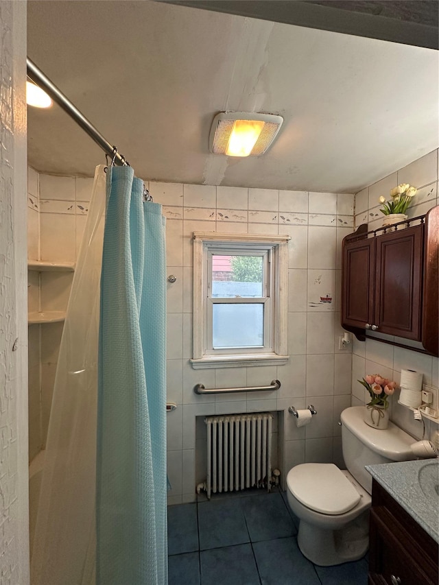 bathroom featuring a shower with curtain, radiator heating unit, tile patterned floors, and toilet