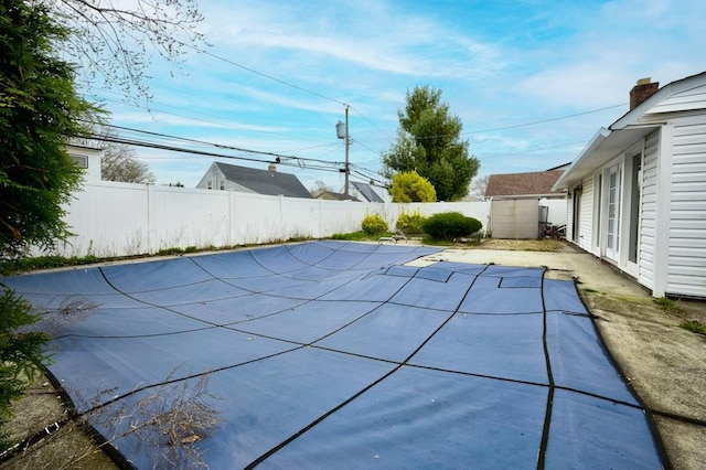 63 Bucket Ln, Levittown, NY 11756 - view of swimming pool with a fenced backyard, a fenced in pool, and a patio