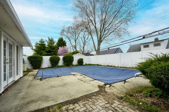 63 Bucket Ln, Levittown, NY 11756 - view of pool with a fenced in pool, french doors, a fenced backyard, and a patio