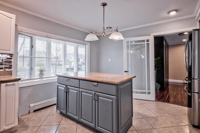 63 Bucket Ln, Levittown, NY 11756 - kitchen featuring freestanding refrigerator, baseboard heating, gray cabinetry, and light tile patterned flooring