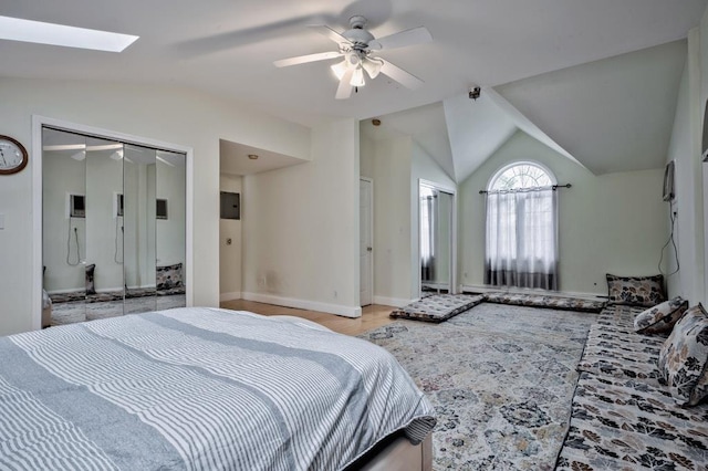 63 Bucket Ln, Levittown, NY 11756 - bedroom featuring ceiling fan, baseboards, and vaulted ceiling with skylight
