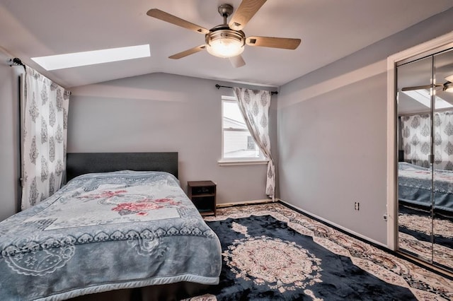 63 Bucket Ln, Levittown, NY 11756 - bedroom featuring baseboards, ceiling fan, and vaulted ceiling with skylight