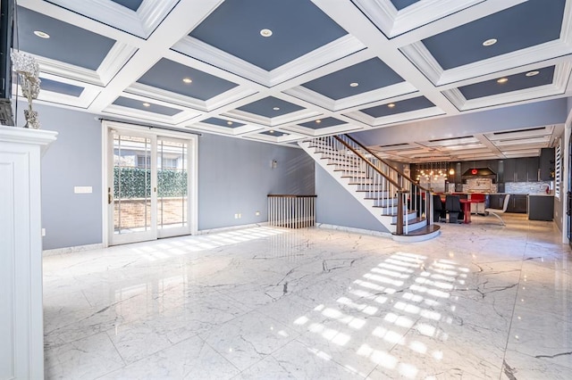 unfurnished living room with marble finish floor, coffered ceiling, stairway, and baseboards